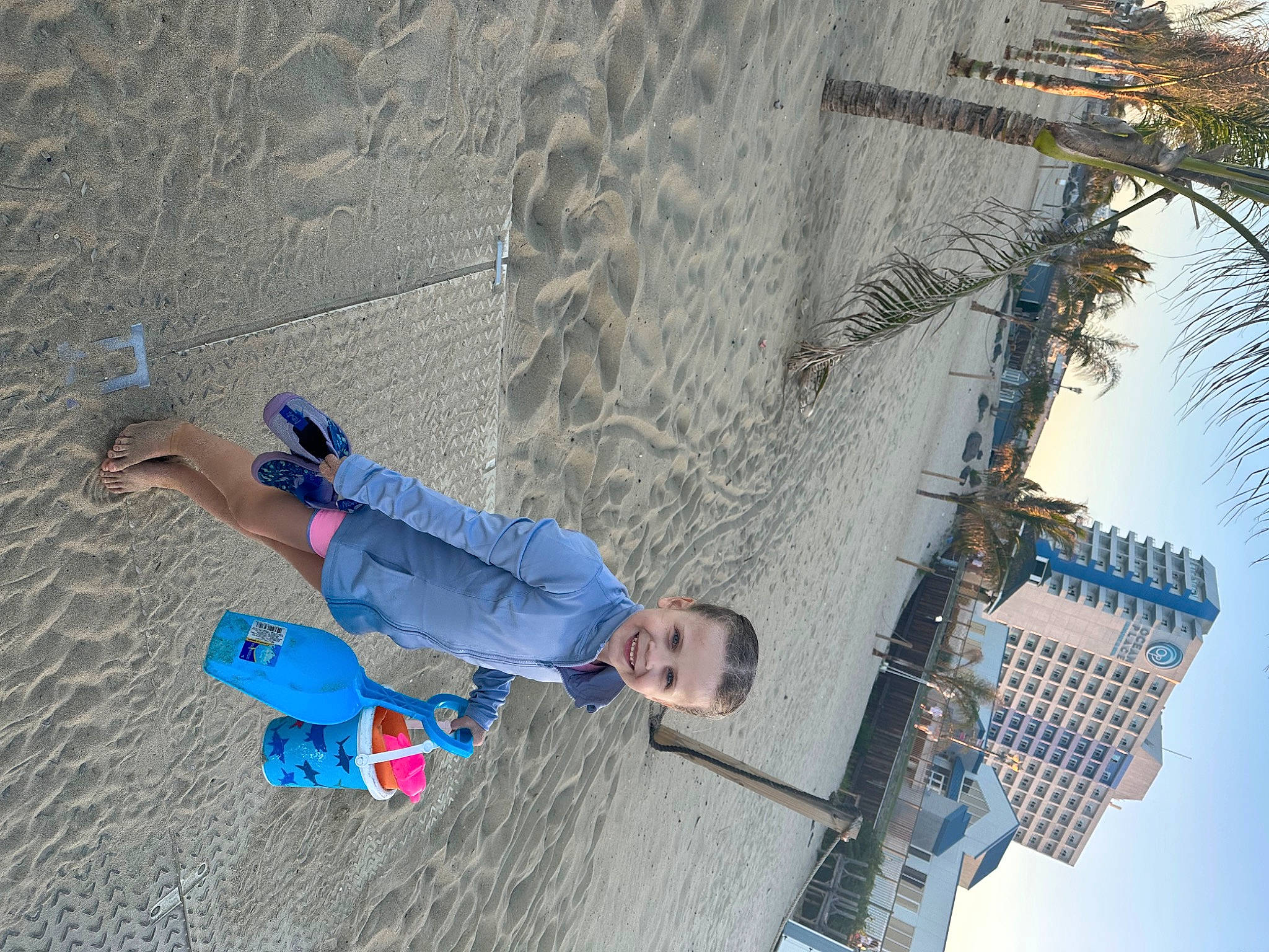 Angelina is registered to the contest to win money with this photo: adventure, building, city, concrete, denim, electric_blue, fun, joy, leisure, line, pedestrian, person, recreation, shadow, sky, slope, smile, toddler, travel, urban_design