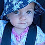 baby, child, face, hat, bucket_hat, polka_dot, clothing, car_seat, seat_belt, pacifier_clip, close_up, infant, cute, portrait, blue, pink, dots, person, smile, young
