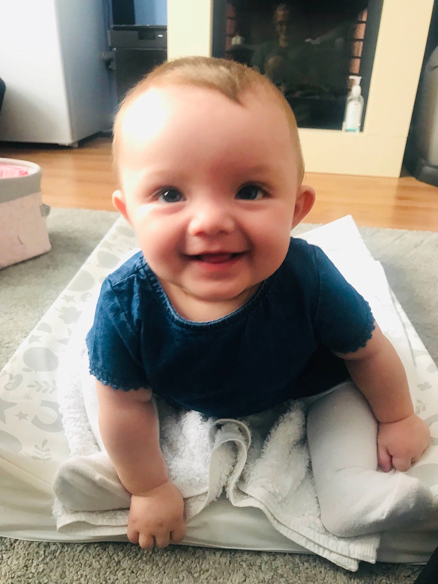 Alanah is registered to the contest to win money with this photo: baby, cheek, child, chin, crawling, eye, face, facial_expression, floor, flooring, forehead, head, joy, leg, lip, nose, person, sitting, skin, smile