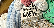 Jaxon joined the competition — help win amazing prizes! newborn, baby, sleeping, blue_hat, animal_print, pants, white_shirt, text_on_clothing, blanket, hospital, person, infant, cute, soft_texture, hand, face, sleep, newborn_clothing, cozy, rest