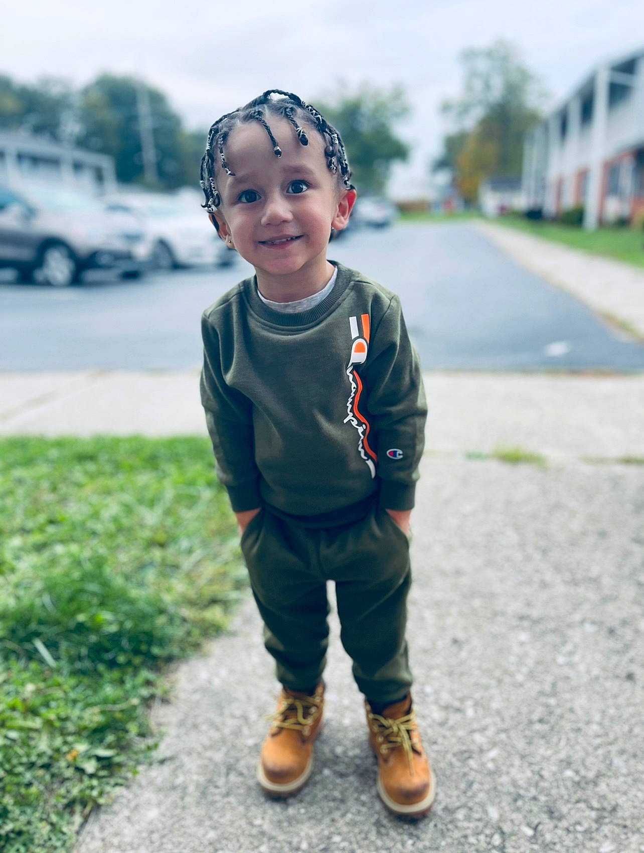 Jakhi is registered to the contest to win money with this photo: asphalt, baby, child, eye, face, fun, grass, happy, head, joy, leaf, person, plant, recreation, road_surface, sky, sleeve, smile, tire, toddler