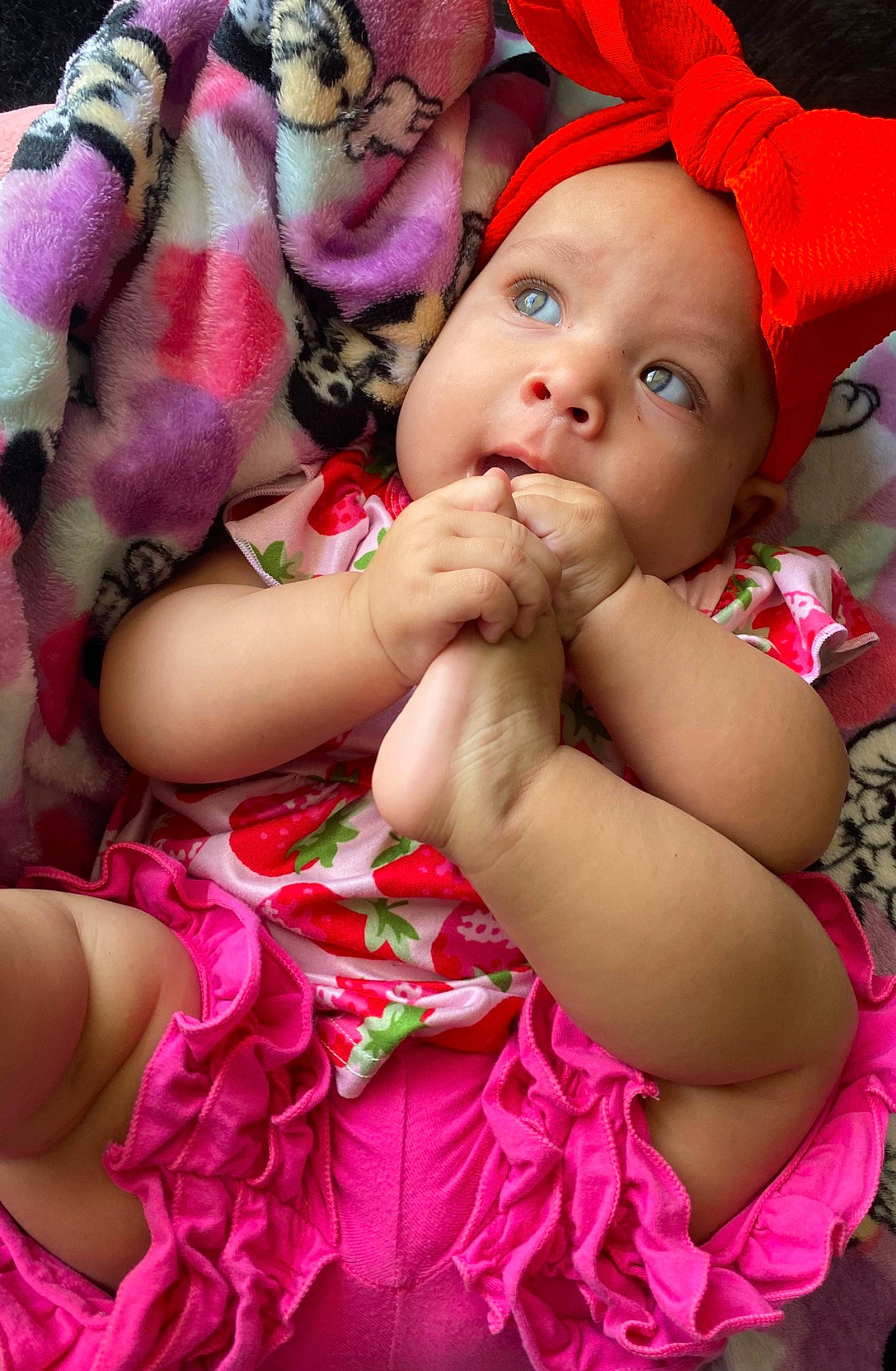 Serenity is registered to the contest to win money with this photo: abdomen, baby, baby_products, baby_toddler_clothing, cheek, child, event, finger, fun, happy, headwear, lip, magenta, nail, pattern, peach, person, pink, red, sitting