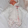 baby, sleeping, white_jacket, hood, pacifier, pacifier_clip, cherry_pattern, pants, socks, bed, blanket, cute, infant, child, newborn, clothing, indoor, resting, adorable, soft