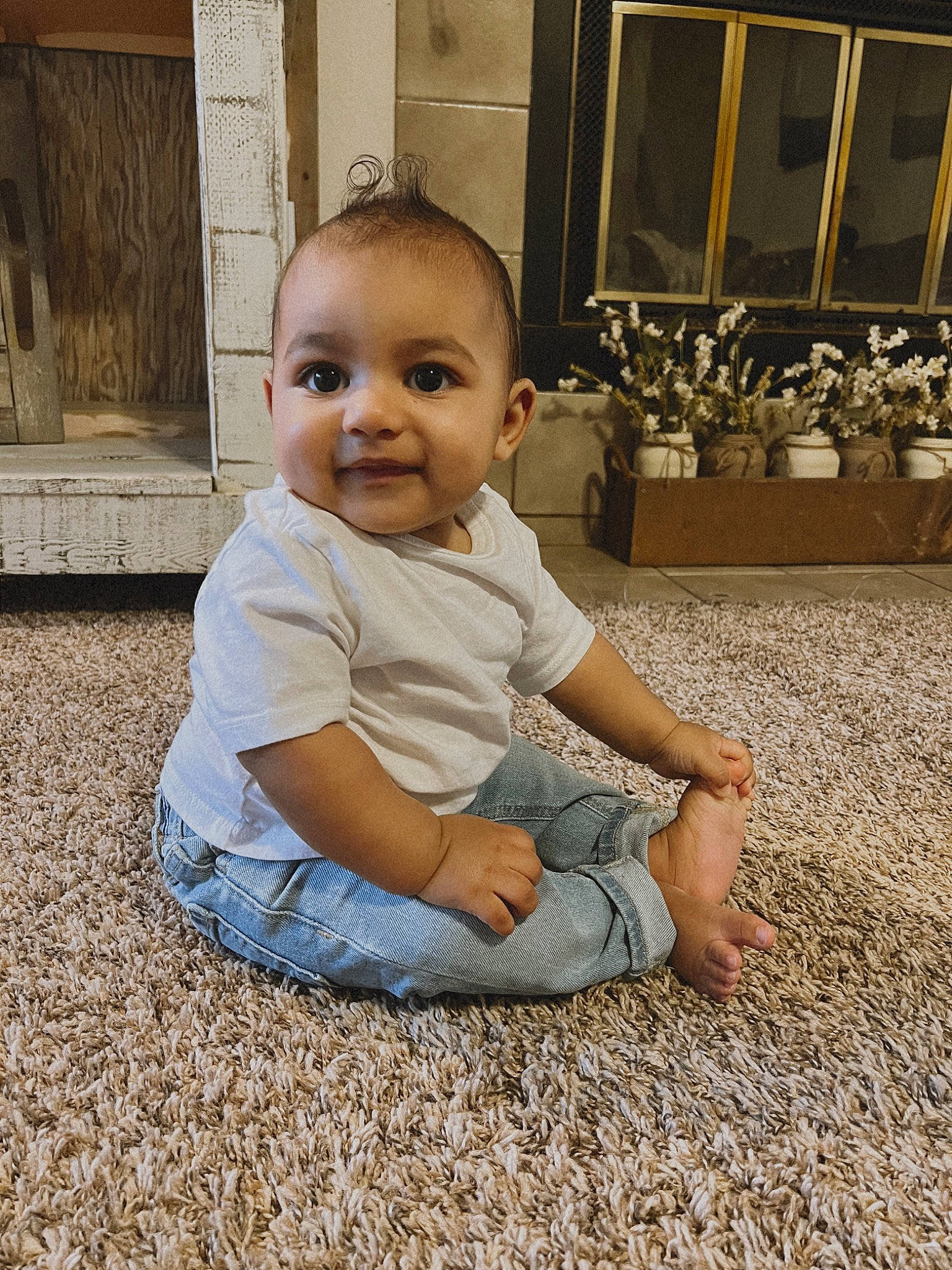 David Jaymes is registered to the contest to win money with this photo: baby, baby_toddler_clothing, child, door, flooring, flowerpot, fun, grass, happy, houseplant, joy, monochrome, people_in_nature, person, plant, sitting, smile, soil, toddler, window