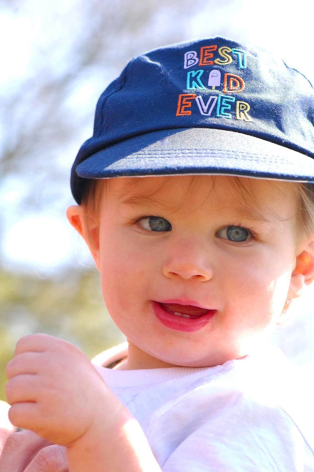 Franklin is registered to the contest to win money with this photo: baby, baby_toddler_clothing, baseball_cap, cap, child, cricket_cap, electric_blue, fashion_accessory, fun, happy, hat, headgear, headwear, lip, person, portrait_photography, recreation, skin, smile, sun_hat