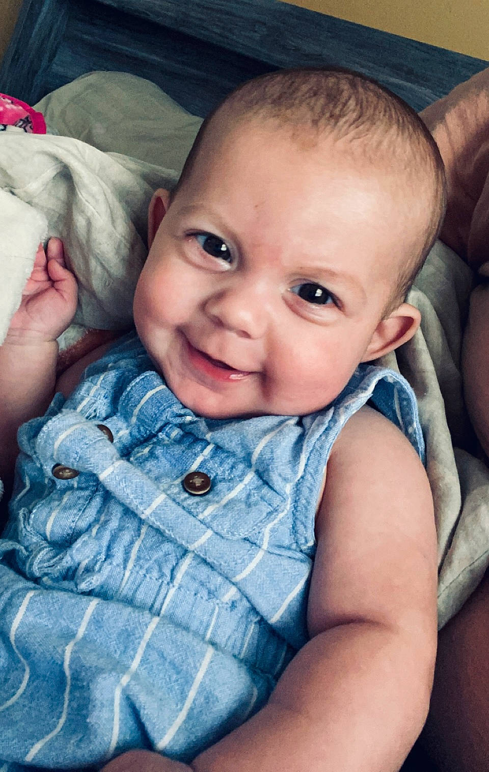 Eleanor-jane is registered to the contest to win money with this photo: arm, azure, baby_toddler_clothing, blue, cheek, chin, comfort, eye, flash_photography, hand, happy, iris, lip, mouth, nose, person, skin, sleeve, smile, textile