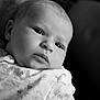 Aria joined the competition — help win amazing prizes! baby, portrait, black_and_white, closeup, infant, face, expression, blanket, soft_focus, newborn, cute, gaze, young_child, peaceful, monochrome, wrapped, skin, head, human, indoors