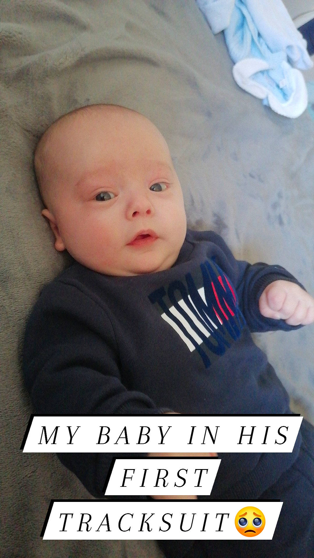 Brody is registered to the contest to win money with this photo: baby, baby_products, baby_toddler_clothing, cheek, child, comfort, electric_blue, eyebrow, eyelash, font, happy, pattern, person, photo_caption, portrait_photography, product, sitting, sleeve, t_shirt, toddler