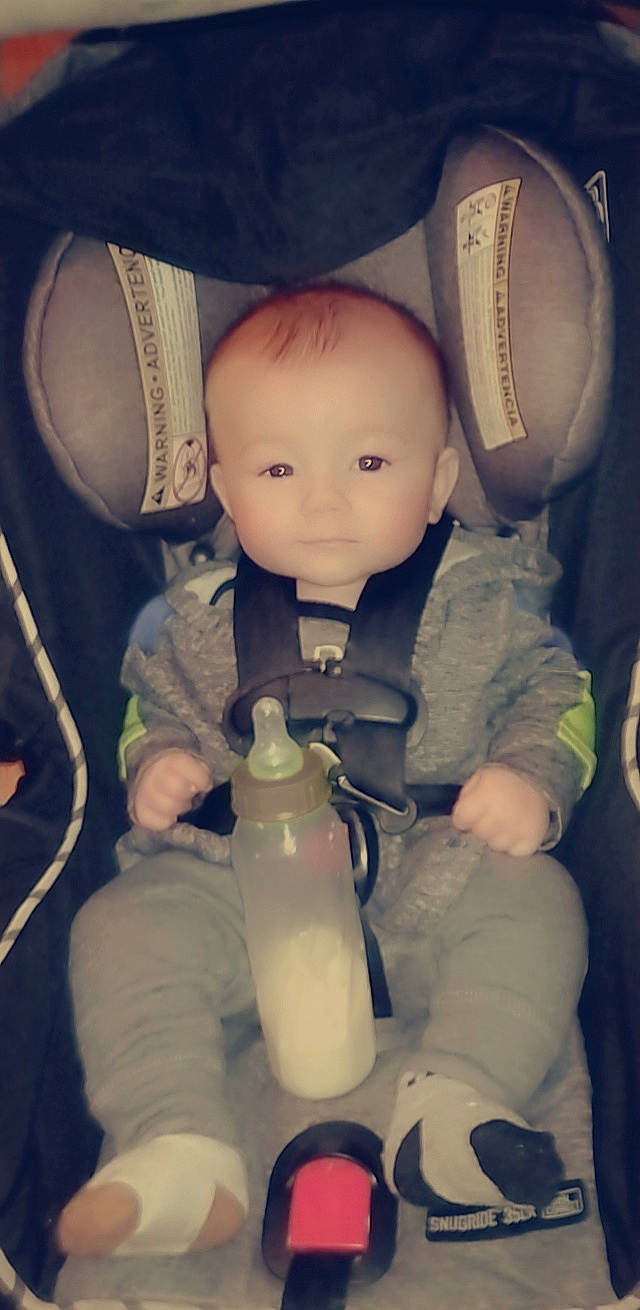 Jenson is registered to the contest to win money with this photo: baby, baby_bottle, baby_products, bottle, child, drink, drinkware, finger, gesture, headgear, nail, organ, person, personal_protective_equipment, plastic_bottle, product, skin, thumb, toddler, toy