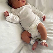 Kenny is registered to the contest to win money with this photo: newborn, baby, sleeping, white_clothing, hospital_band, blanket, infant, peaceful, lying_down, soft_light, indoors, human, skin, legs, arms, face, head, resting, cute, toddler