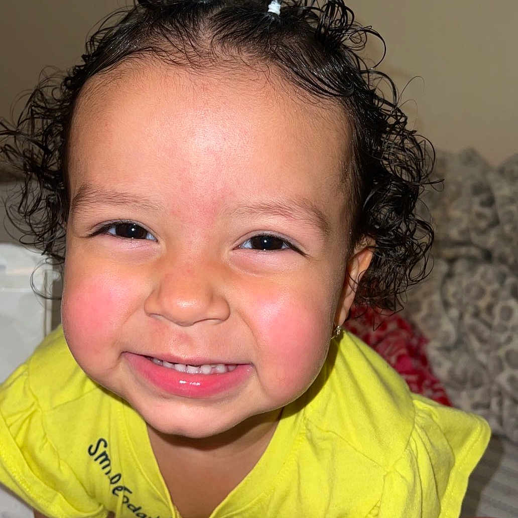 Layla joined the competition — help win amazing prizes! baby, bed, bedroom, bodypart, crawling, cushion, face, furniture, happy, head, homedecor, indoors, laughing, mouth, person, photography, portrait, room, smile, teeth