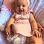 Miley is registered to the contest to win money with this photo: baby, infant, smiling, pink_dress, headband, shoe, bracelet, blanket, white, heart_sign, months, cute, child, happy, portrait, closeup, soft_texture, indoor, adorable, celebration