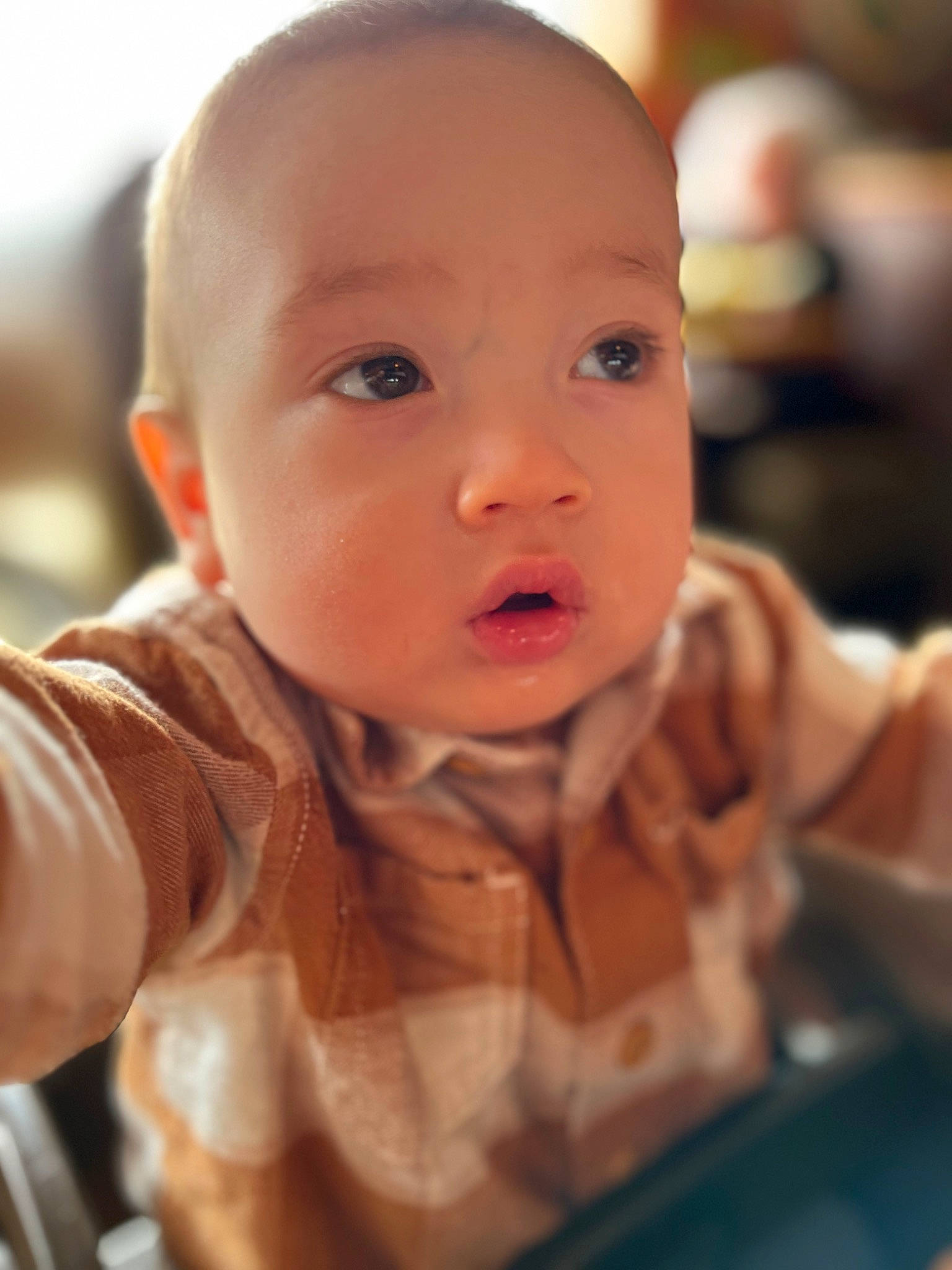 Dakota is registered to the contest to win money with this photo: baby, baby_toddler_clothing, cheek, child, ear, eyebrow, eyelash, fun, happy, iris, lip, nail, nose, person, sitting, skin, sleeve, smile, thumb, toddler