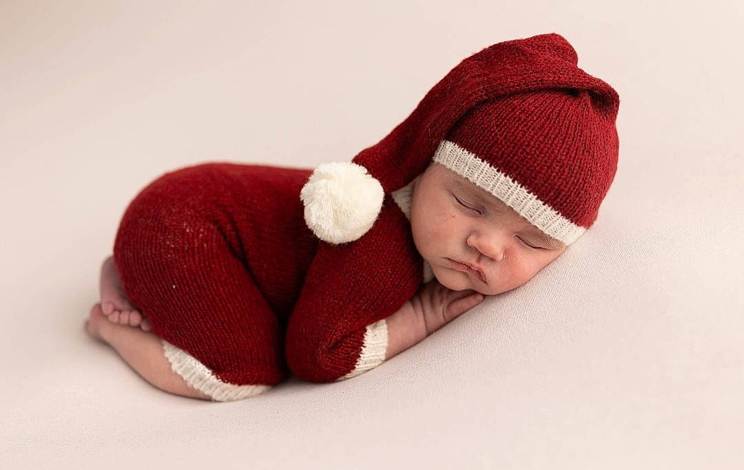 Deegan joined the competition — help win amazing prizes! art, baby, baby_sleeping, baby_toddler_clothing, beanie, cap, carmine, comfort, costume_accessory, craft, creative_arts, fashion_accessory, headgear, headwear, knit_cap, magenta, pattern, person, plant, toddler