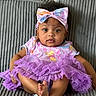Cierra is registered to the contest to win money with this photo: baby, child, tutu, purple, headband, bow, couch, seated, clothing, cute, infant, portrait, indoors, happy, smile, feet, hands, fabric, texture, person