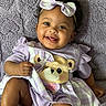 baby, blanket, bow, child, clothing, cute, dress, face, fingers, foot, happy, headband, infant, pattern, plush, portrait, sitting, skin, smiling, toddler