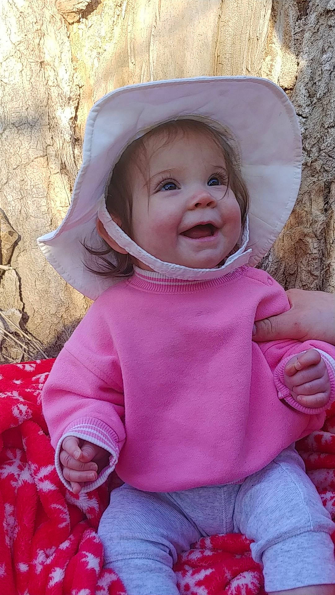 Jazlyn is registered to the contest to win money with this photo: arm, baby, baby_toddler_clothing, cheek, clothing, eye, face, happy, head, human_body, iris, lip, nose, outerwear, people_in_nature, person, pink, skin, sleeve, smile