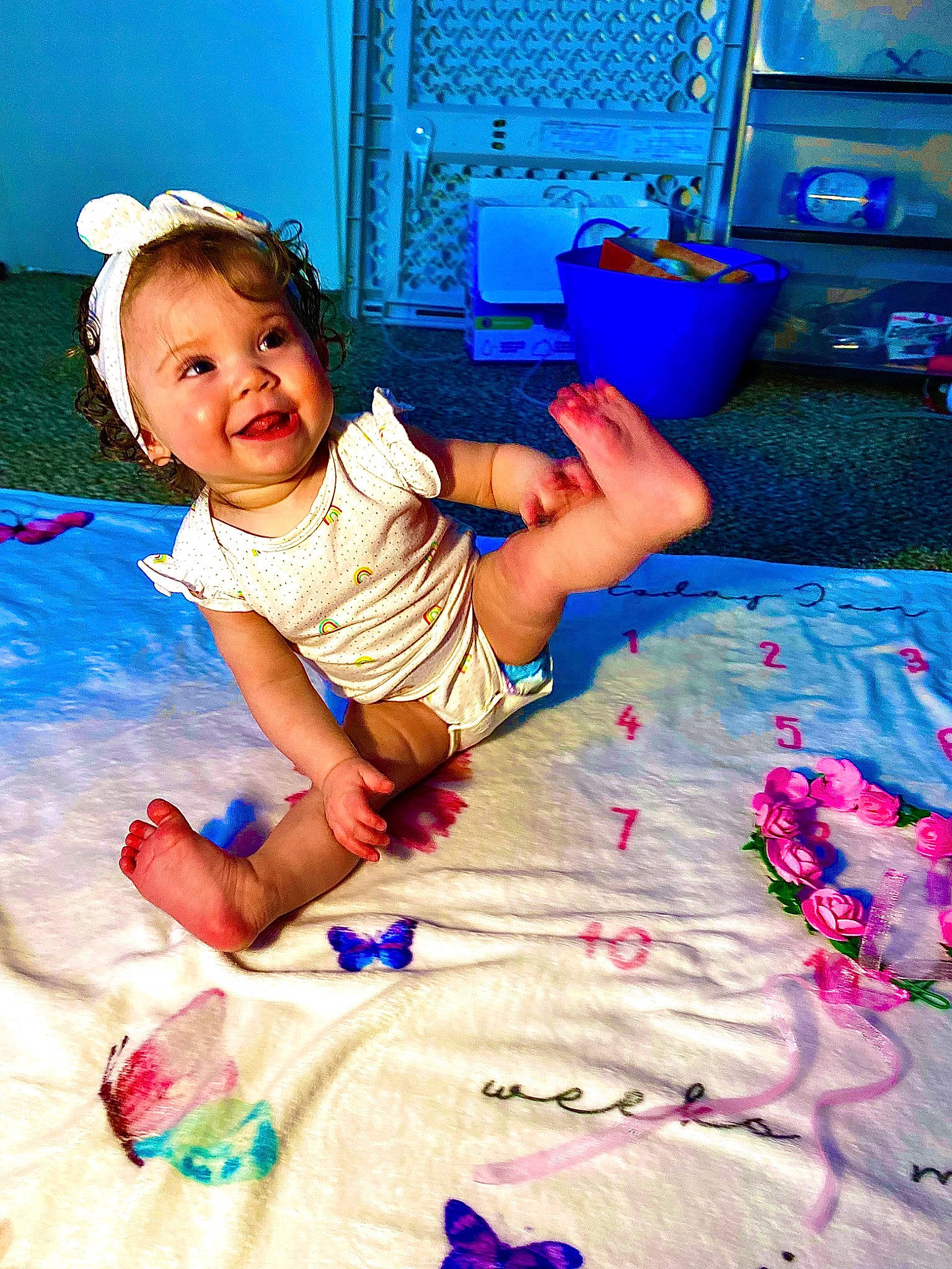 Jazlyn is registered to the contest to win money with this photo: baby, baby_toddler_clothing, blue, child, electric_blue, flash_photography, flooring, fun, happy, leisure, linens, magenta, person, pink, play, purple, sitting, t_shirt, television, textile