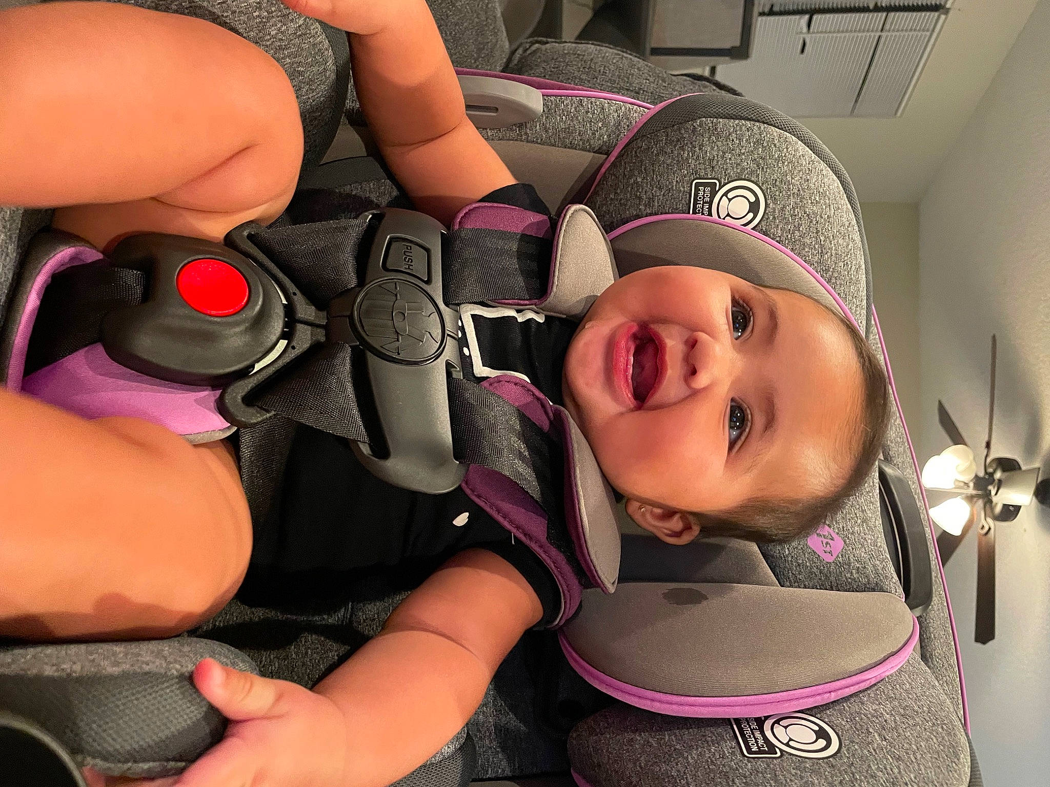 Jessie joined the competition — help win amazing prizes! auto_part, baby, baby_toddler_clothing, car_seat, child, comfort, cool, finger, flash_photography, fun, gesture, happy, magenta, mouth, person, personal_protective_equipment, pink, purple, smile, thumb