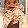 baby, child, smiling, person, hand, clothing, pink_sweater, indoor, portrait, cute, happy, holding, face, skin, hair, baby_hair, infant, childhood, people, warmth