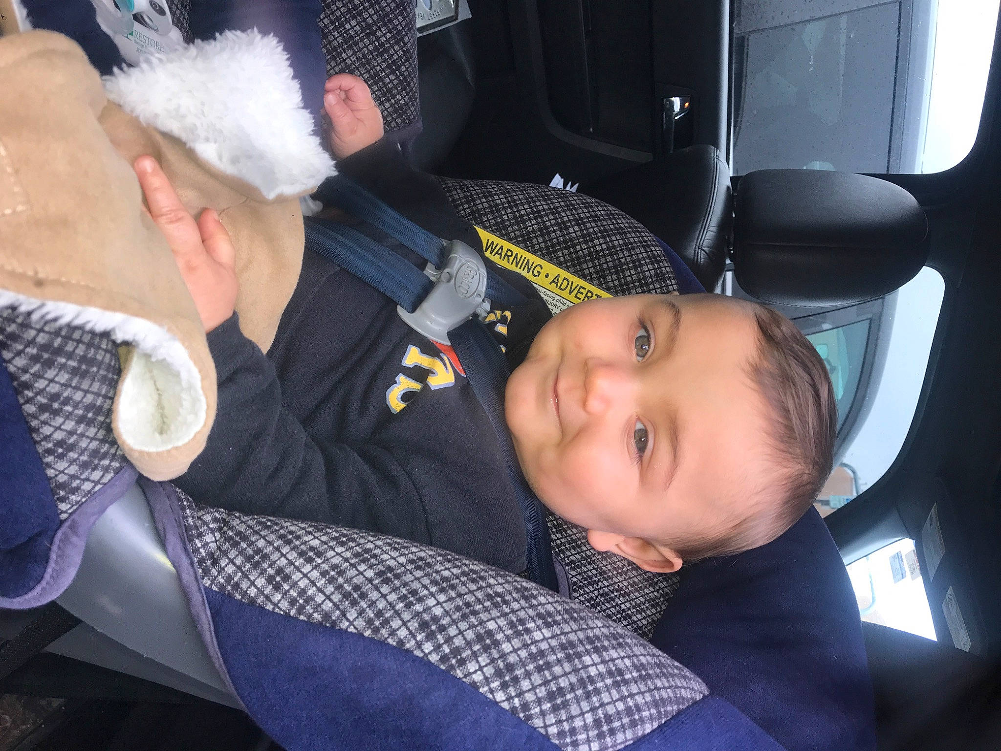 Skyler joined the competition — help win amazing prizes! auto_part, baby, baby_products, car_seat, car_seat_cover, child, comfort, event, family_car, fun, hat, joy, lap, luxury_vehicle, motor_vehicle, person, sitting, smile, tie, toddler