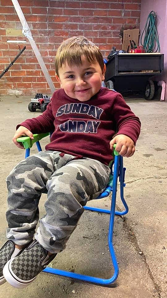 Skyler joined the competition — help win amazing prizes! child, city, facial_expression, fun, grass, hairstyle, hand, happy, joy, leg, leisure, people, person, recreation, sitting, skin, smile, t_shirt, tire, toddler