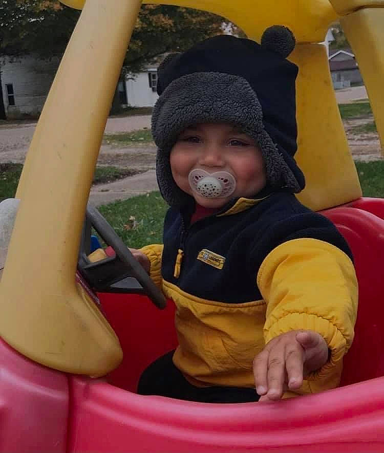 Skyler joined the competition — help win amazing prizes! auto_part, automotive_exterior, baby, baby_toddler_clothing, cap, child, city, fun, grass, headwear, joy, leisure, outdoor_play_equipment, person, plant, play, playground, public_space, recreation, sitting