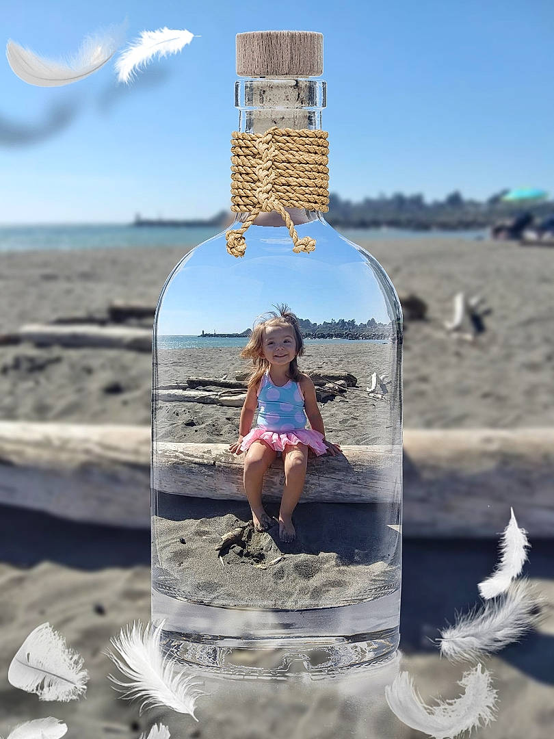 Makenzie is registered to the contest to win money with this photo: beach, bottle, fun, headwear, joy, leisure, ocean, person, sand, sea, shore, summer, vacation, water, water_bottle