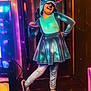 adult, cartoon, clothing, costume, dancing, face, female, footwear, head, leisureactivities, light, lighting, performer, person, purple, shoe, soloperformance, stage, urban, woman