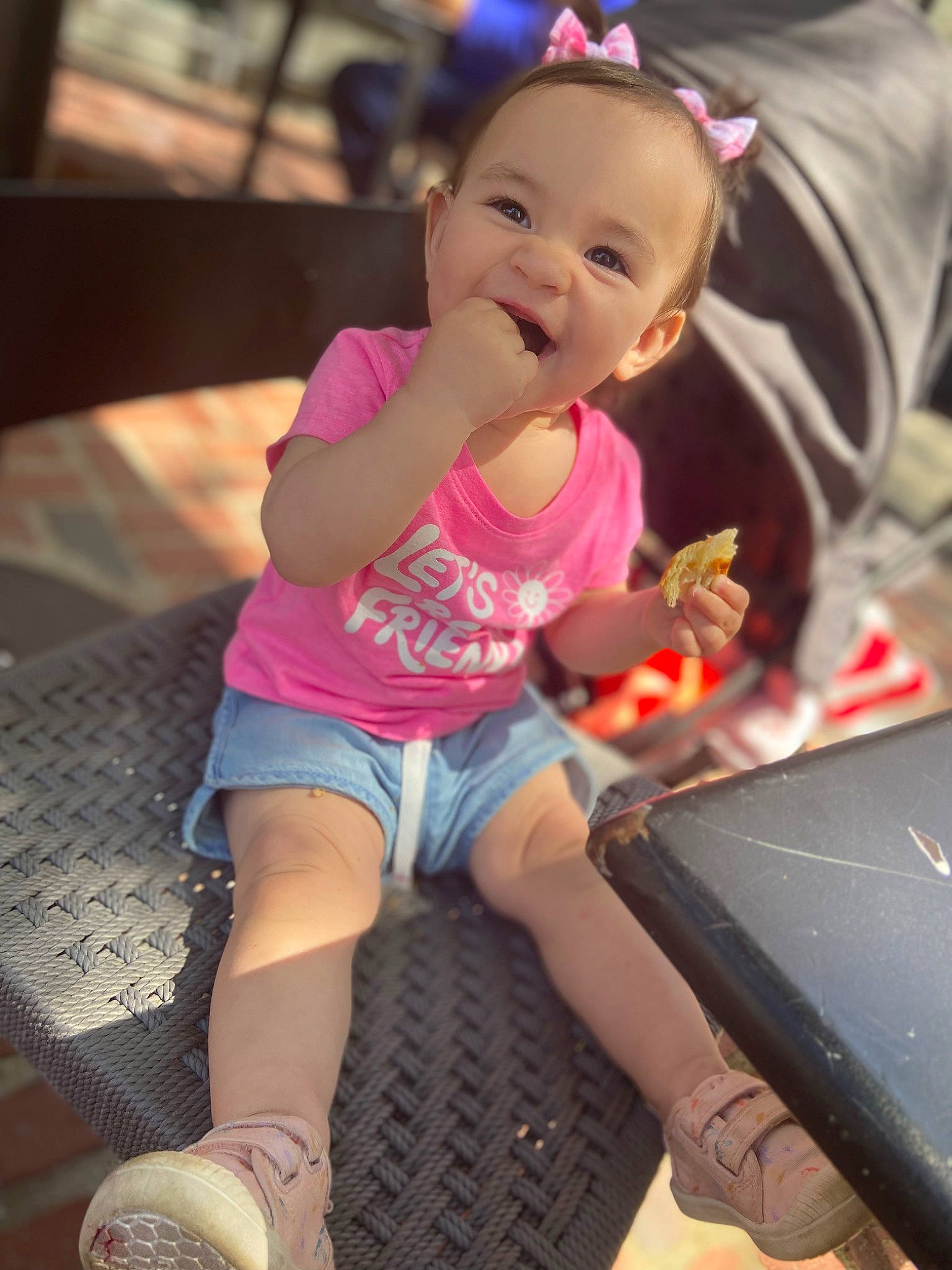 Gabriela is registered to the contest to win money with this photo: eye, fun, hair, hand, happy, human_body, jean_short, knee, lap, mouth, people, person, pink, shoe, shorts, skin, smile, sneakers, thigh, toddler