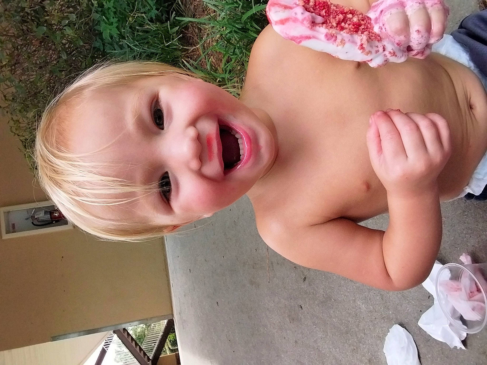 Legend is registered to the contest to win money with this photo: baby, cheek, eye, eyebrow, eyelash, fun, gesture, grass, happy, headgear, human_body, lip, mouth, muscle, neck, nose, person, pink, skin, smile