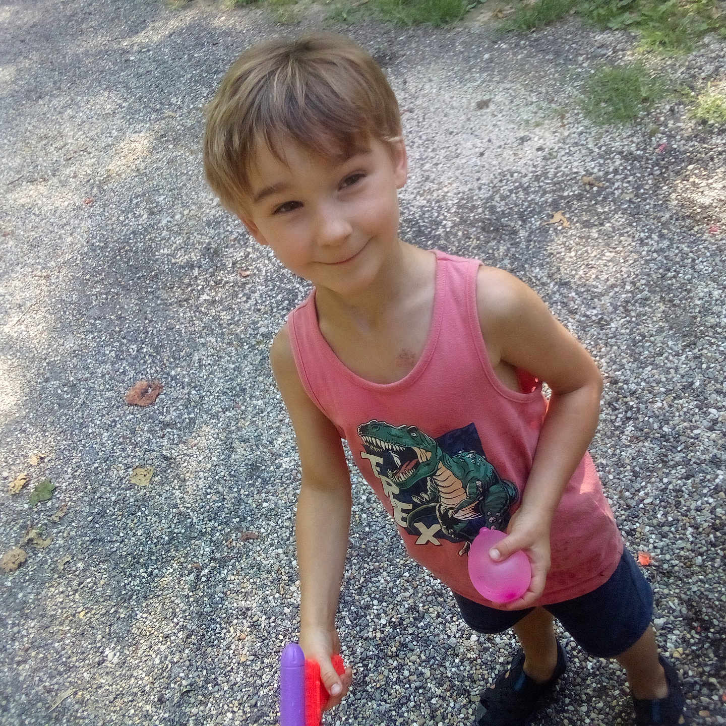 Devin is registered to the contest to win money with this photo: child, city, clothing, face, female, footwear, girl, grass, head, path, person, photography, portrait, road, shoe, shorts, street, t_shirt, urban, walking