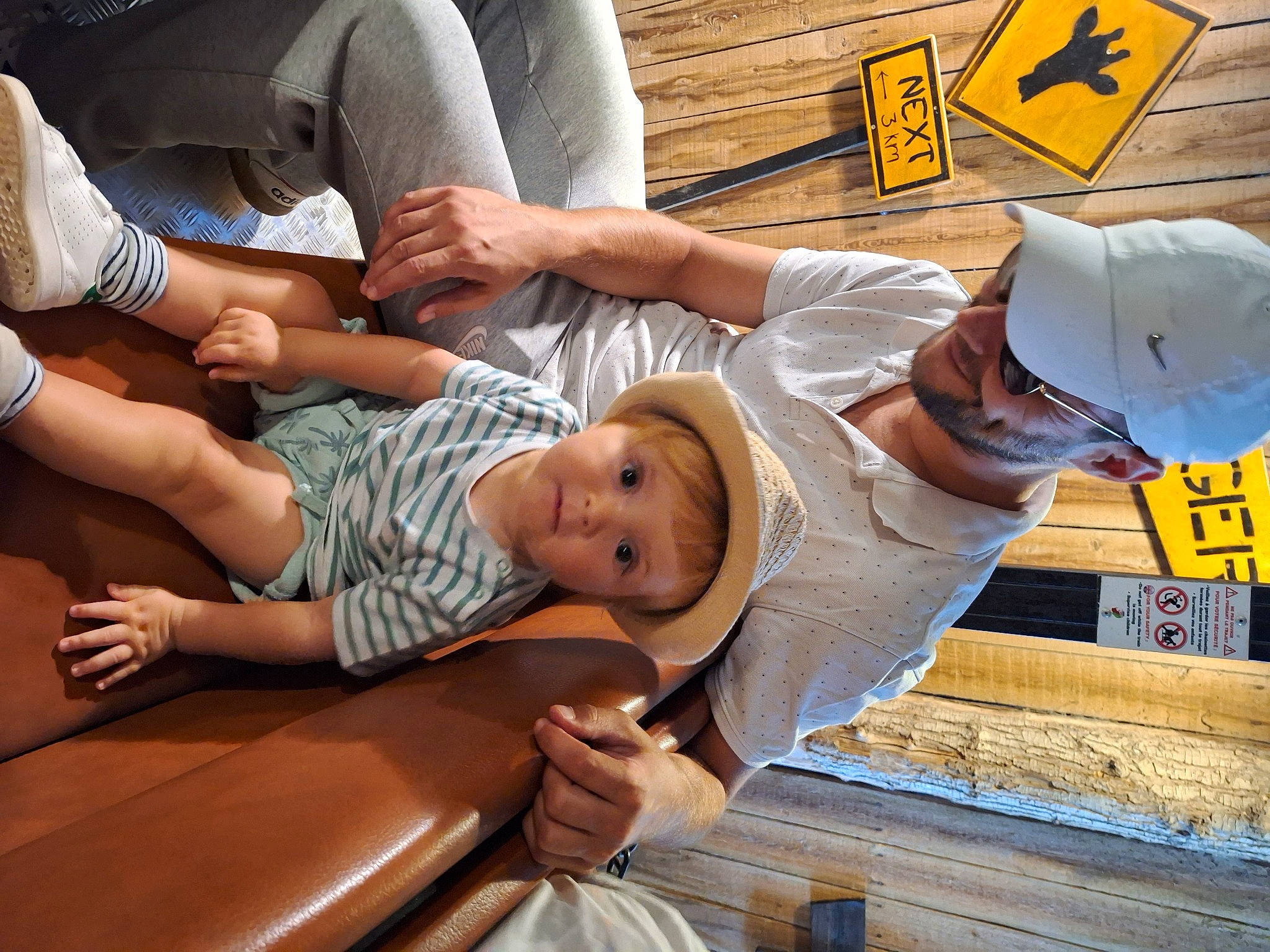 Sacha a rejoint le concours — aidez-le/la à gagner de superbes lots ! baby, baseball_cap, cap, child, comfort, foot, fun, hat, human_leg, knee, lap, leisure, person, product, room, shorts, sitting, t_shirt, thigh, toddler