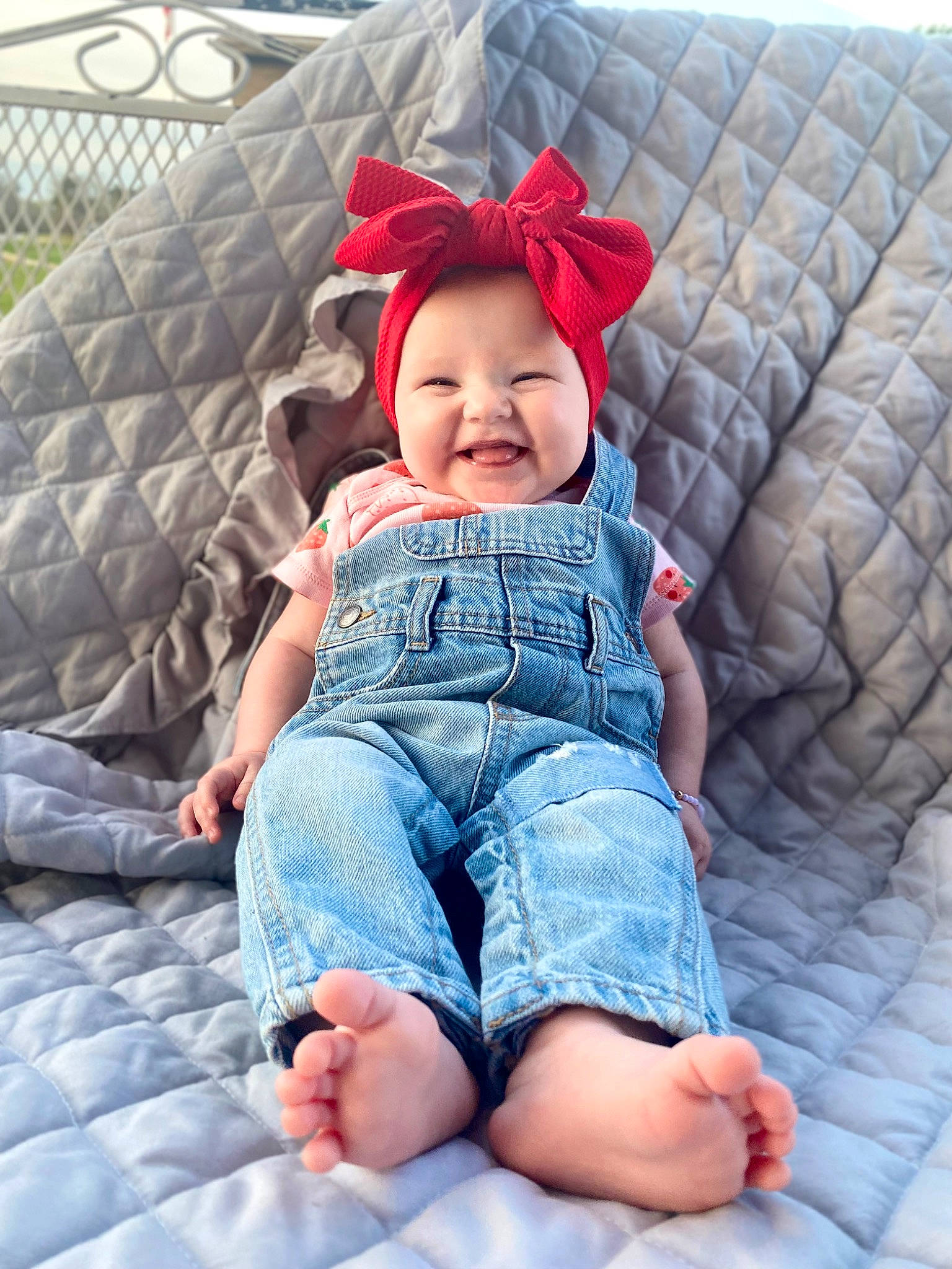Jessica is registered to the contest to win money with this photo: baby_toddler_clothing, barefoot, comfort, denim, eye, finger, happy, headwear, human, jeans, joy, leg, mouth, organ, person, plant, product, skin, sleeve, smile