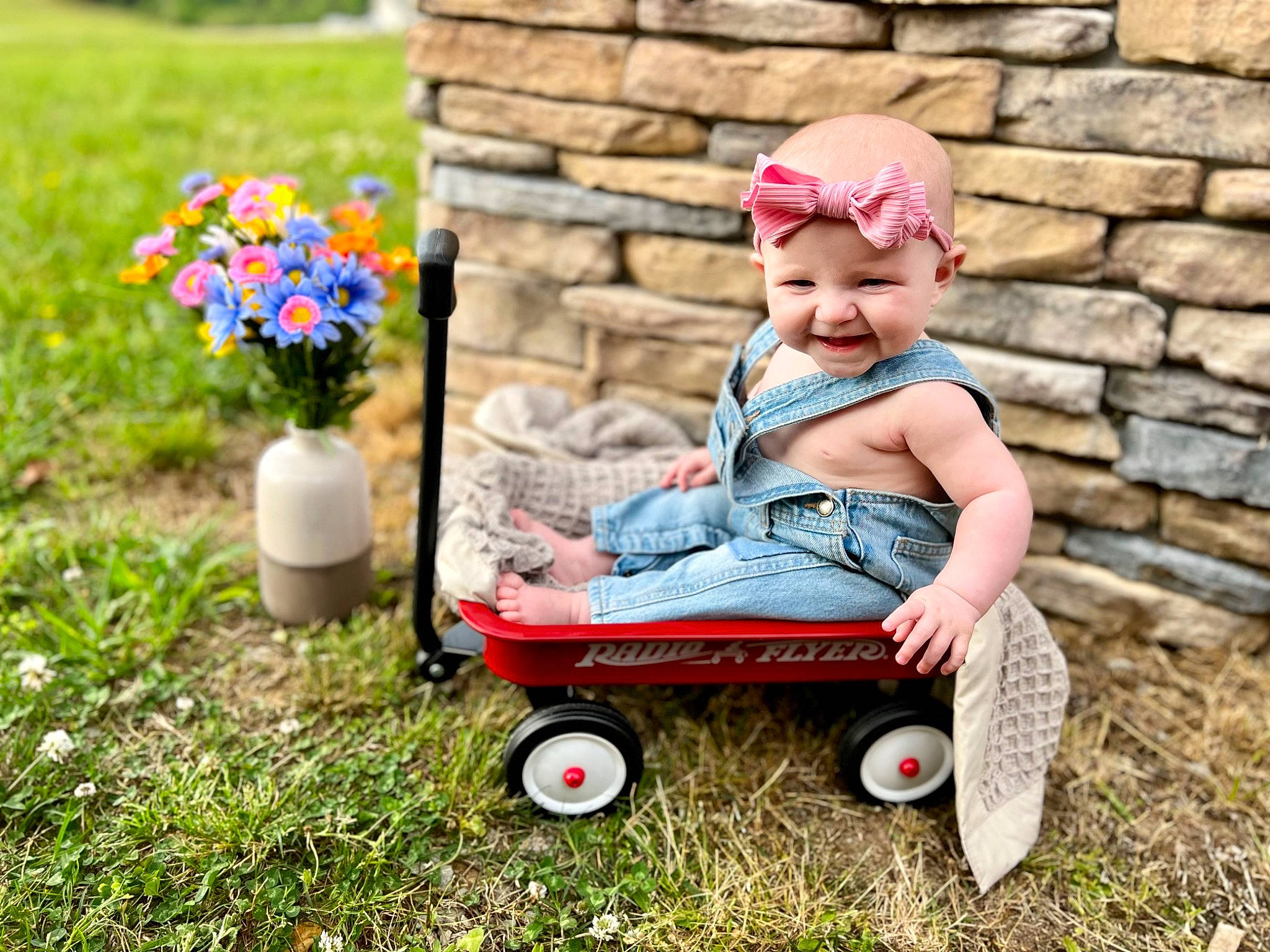 Jessica joined the competition — help win amazing prizes! annual_plant, baby, baby_toddler_clothing, child, flower, fun, grass, happy, headwear, joy, lawn, leisure, people_in_nature, person, petal, plant, recreation, sitting, smile, tire