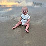 Ryder is registered to the contest to win money with this photo: baby, beach, building, casual, child, clothing, footwearless, happy, infant, nature, outdoor, person, reflection, sand, sitting, sky, smiling, sunset, vacation, water