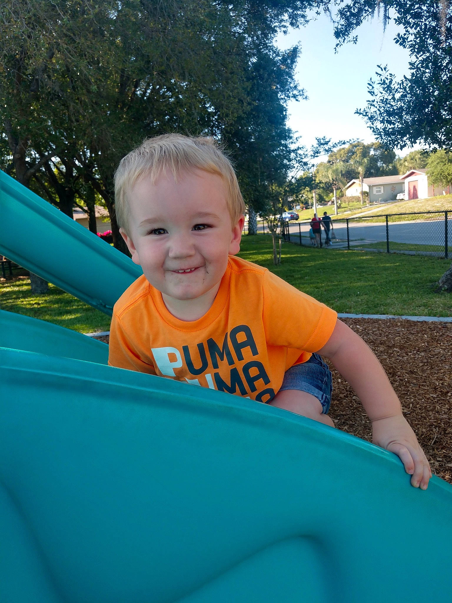 Gavyn joined the competition — help win amazing prizes! blue, child, city, fun, grass, green, happy, human_settlement, joy, leisure, outdoor_play_equipment, person, play, playground, public_space, recreation, skin, smile, summer, toddler
