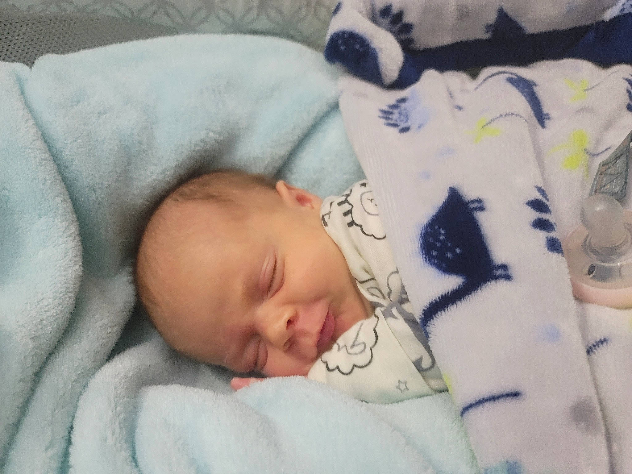 Sawyer is registered to the contest to win money with this photo: baby, baby_products, baby_sleeping, baby_toddler_clothing, bedding, bedtime, blanket, cheek, child, comfort, facial_expression, linens, nap, pattern, person, room, skin, sleep, sleeve, toddler