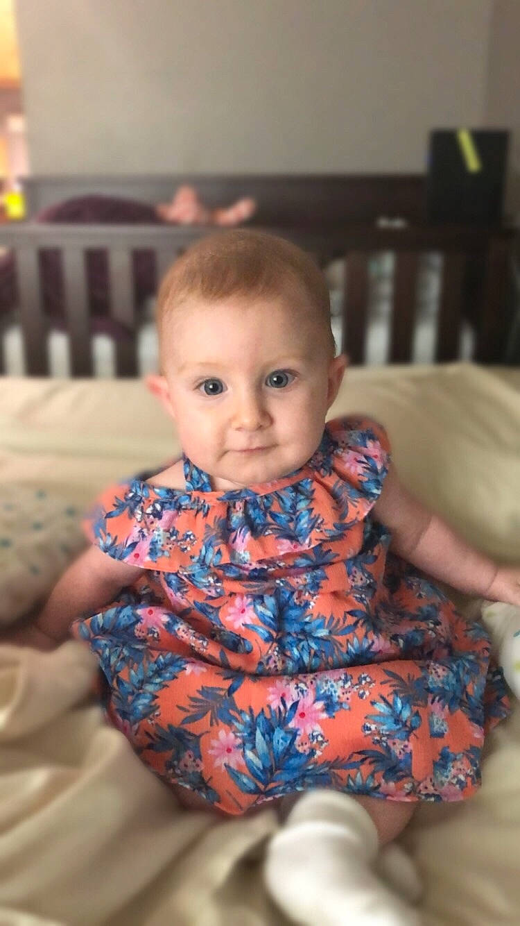 Rhiannon is registered to the contest to win money with this photo: baby, cheek, child, eye, face, head, iris, person, play, sitting, skin, smile, toddler