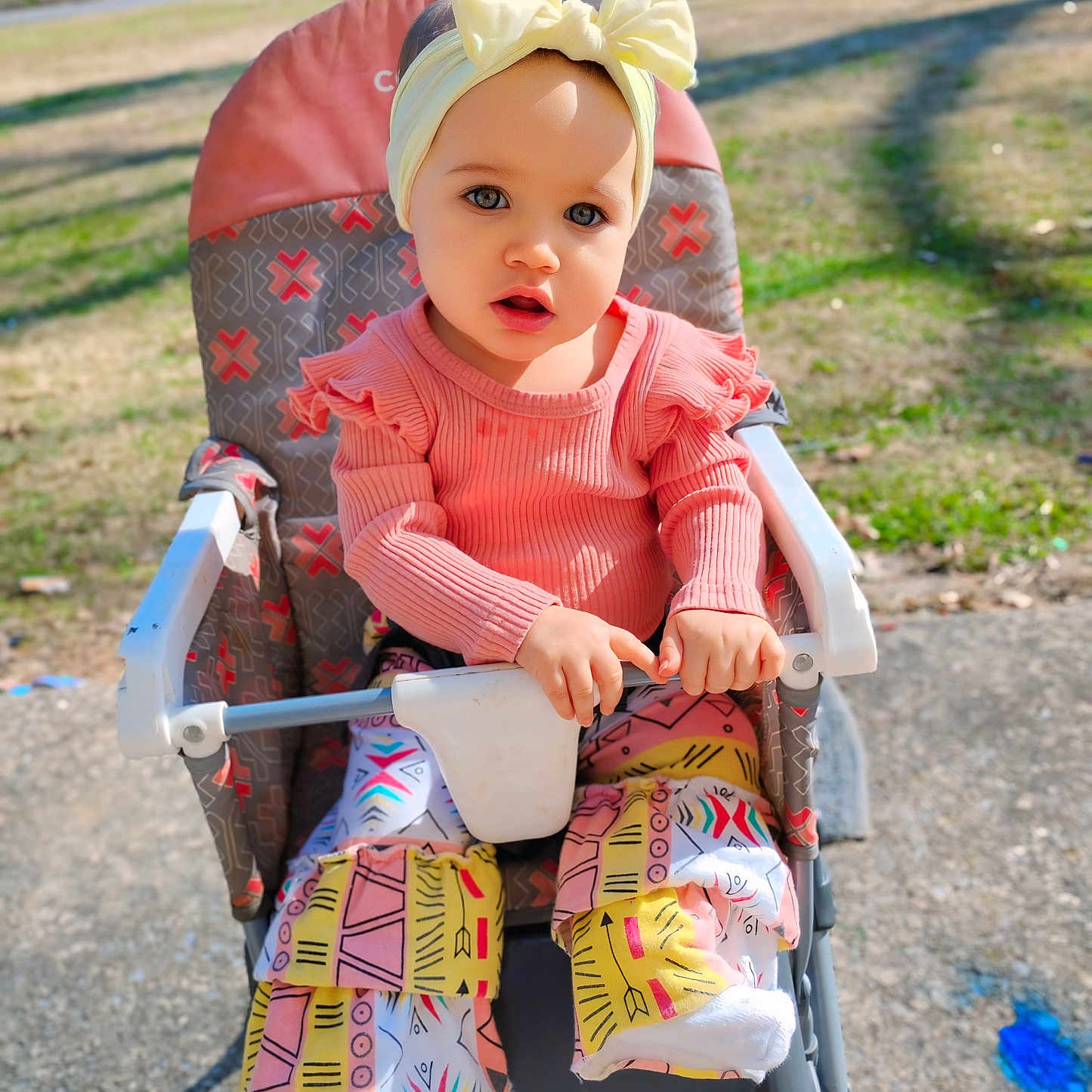 Aleena joined the competition — help win amazing prizes! baby, bonnet, cap, chair, clothing, doll, dress, face, furniture, grass, hat, head, machine, person, photography, plant, portrait, sitting, stroller, toy
