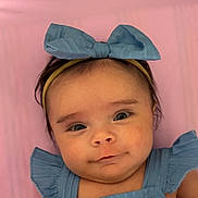 Antonella joined the competition — help win amazing prizes! baby, child, infant, headband, bow, blue_clothing, pink_background, portrait, closeup, cute, smile, face, expression, young_child, soft_lighting, indoor, person, human, adorable, fashion_accessory