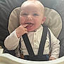 Timeo participe au concours pour gagner de l'argent avec cette photo : baby, high_chair, child, smiling, happy, face, fingers, clothing, suspenders, seatbelt, indoor, infant, cute, person, young_child, playful, portrait, baby_girl, baby_boy, seat