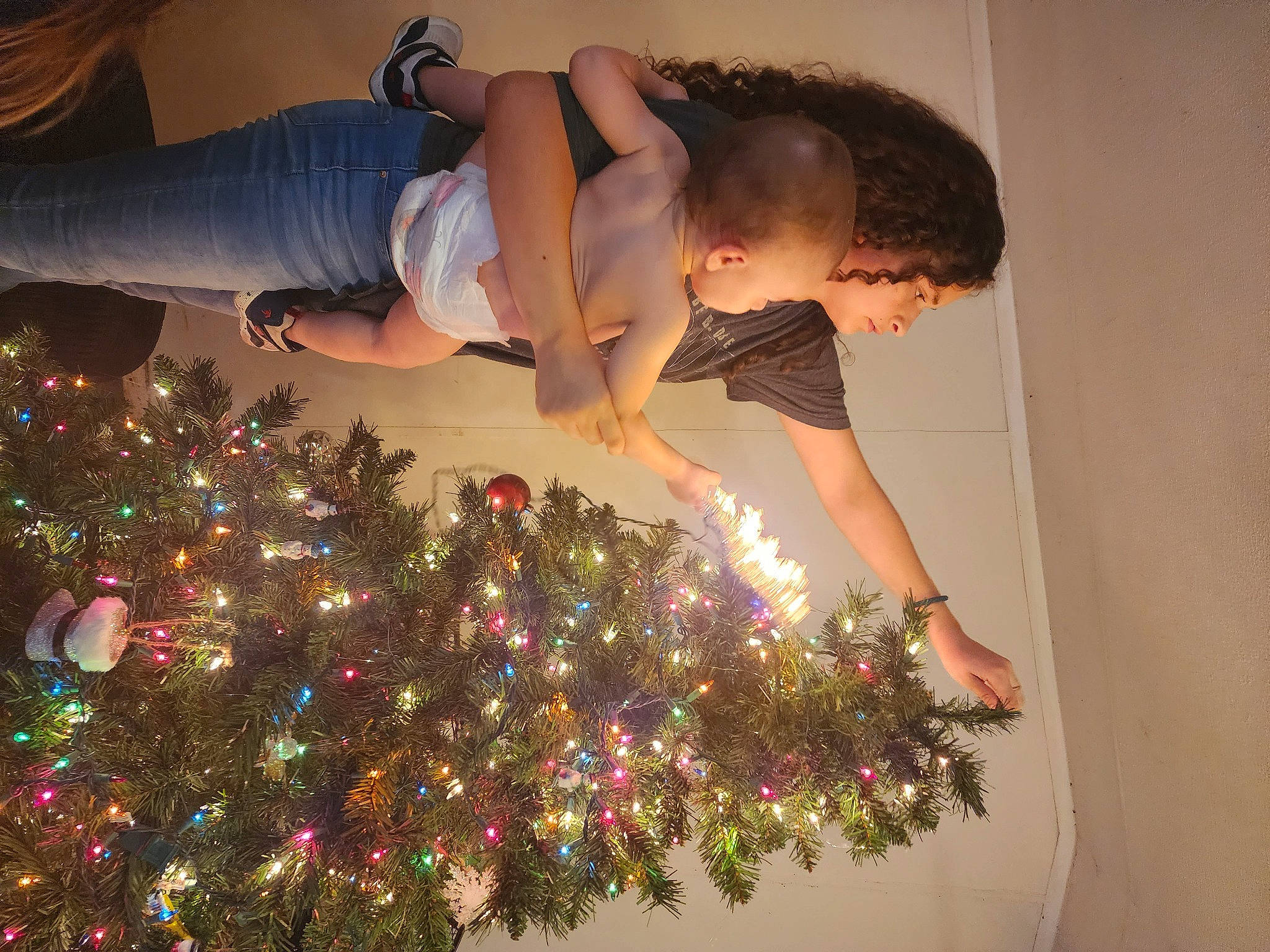 Destinee joined the competition — help win amazing prizes! arm, child, christmas, christmas_decoration, christmas_ornament, christmas_tree, dress, event, facial_expression, fun, gesture, hair, happy, holiday, holiday_ornament, human_leg, interior_design, ornament, person, plant