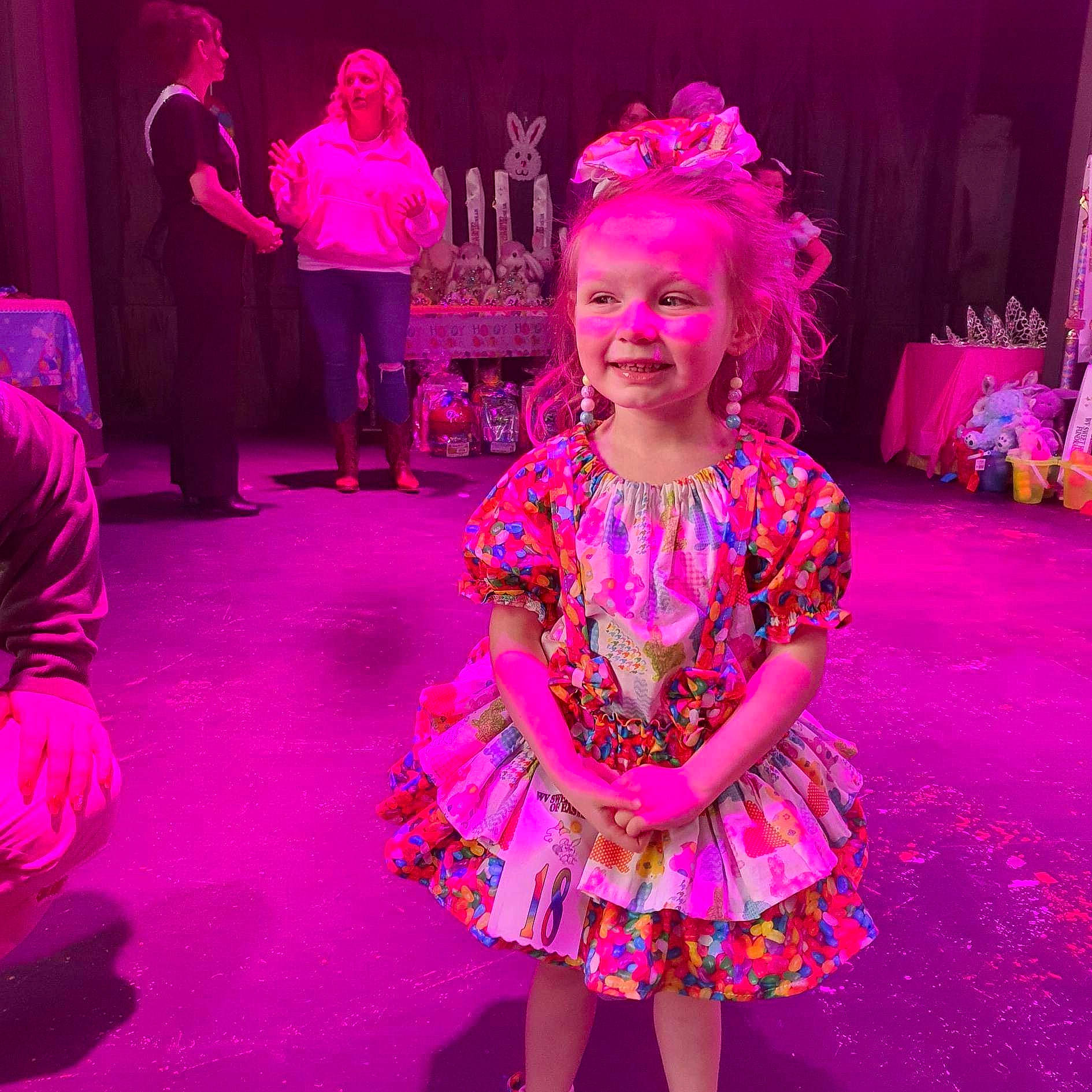 Skylar is registered to the contest to win money with this photo: baby_toddler_clothing, child, dress, entertainment, event, facial_expression, fashion_design, flooring, fun, happy, human, joy, magenta, performance_art, performing_arts, person, pink, purple, smile, toddler