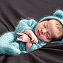 Giovanni joined the competition — help win amazing prizes! newborn, baby, sleeping, blue_outfit, knitted_clothing, bear_ears, soft_blanket, infant, peaceful, cute, portrait, cozy, child, warm, fuzzy, resting, tiny_hands, head, closed_eyes, indoors