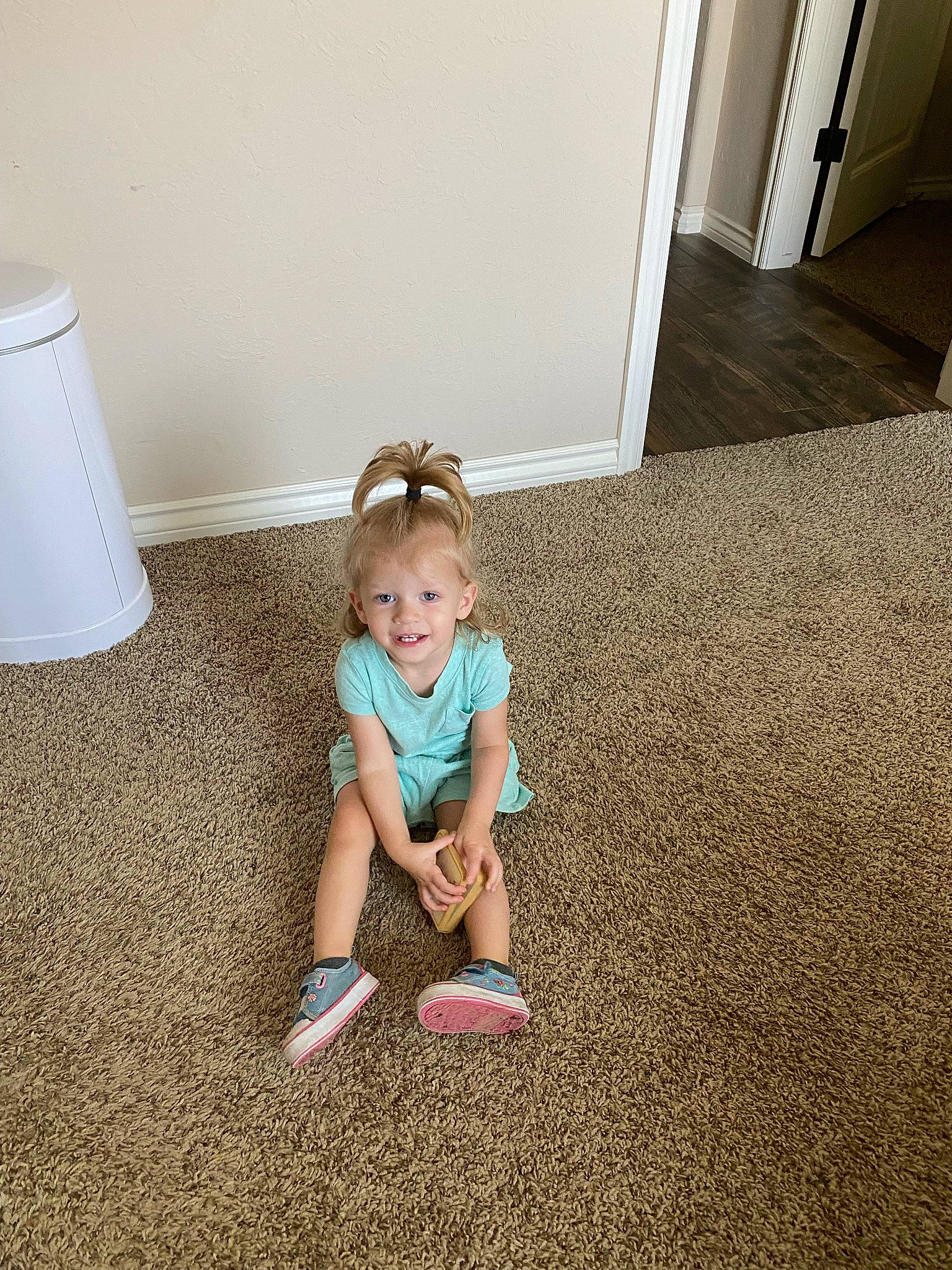 Kayleigh joined the competition — help win amazing prizes! baby, baby_toddler_clothing, child, floor, flooring, foot, glasses, grass, hardwood, human_leg, joy, knee, lamp, leisure, pattern, person, sitting, standing, t_shirt, thigh