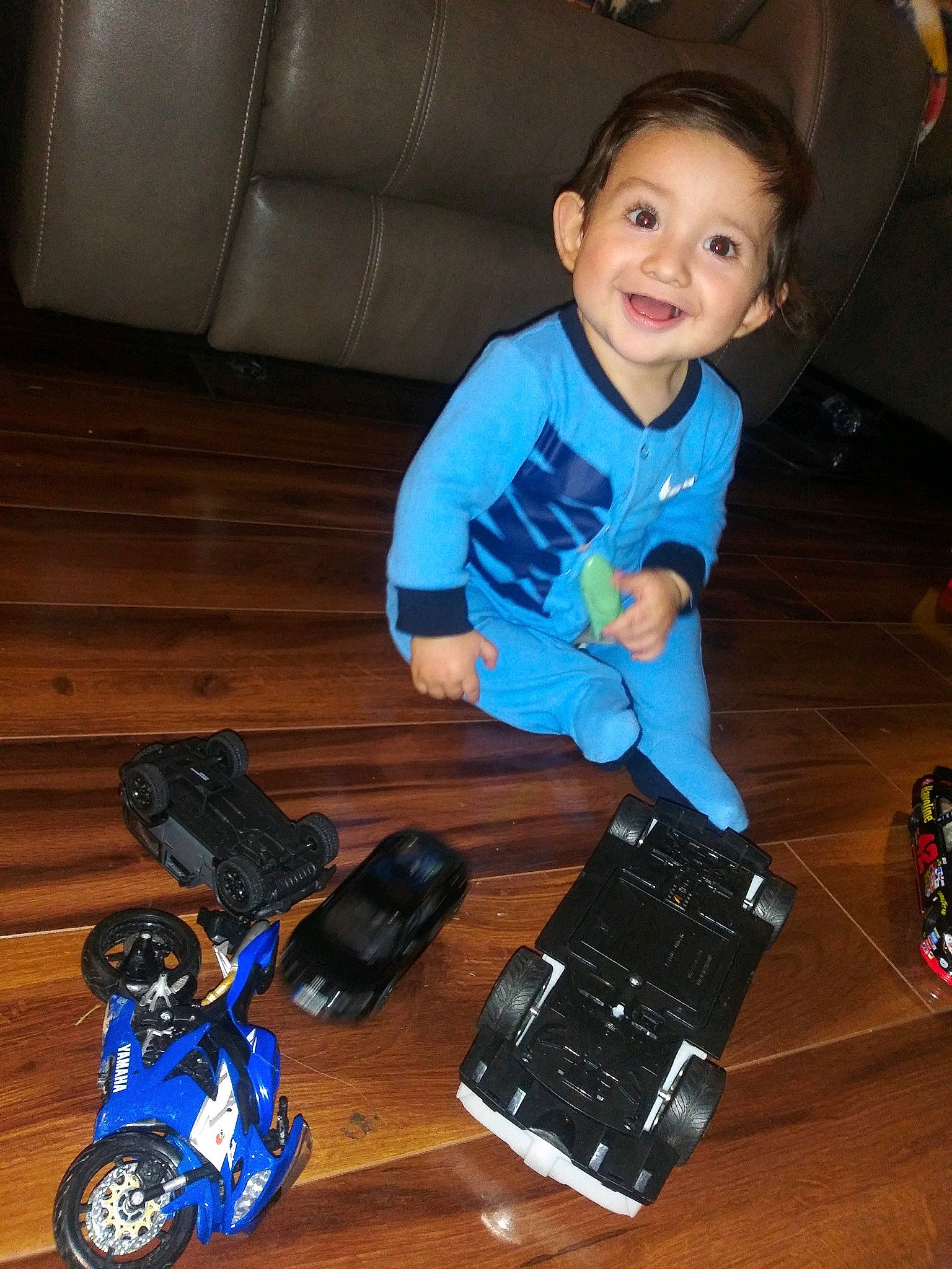 Joaquin joined the competition — help win amazing prizes! audio_equipment, blue, child, comfort, couch, electric_blue, electronic_device, finger, flooring, fun, gadget, hardwood, joy, person, shoe, sitting, smile, technology, toddler, toy