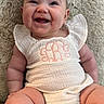 Georgia is registered to the contest to win money with this photo: baby, smiling, infant, onesie, white_clothing, fluffy_blanket, chubby_cheeks, happy, cute, sitting, portrait, child, soft_texture, indoors, skin, cute_expression, monogram, infant_clothing, plush, young_child