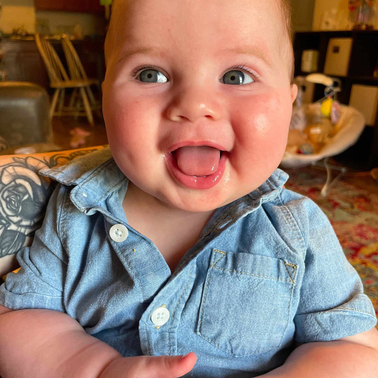 Jasper is registered to the contest to win money with this photo: baby, babylaughing, bodypart, chair, clothing, face, furniture, happy, head, jeans, laughing, mouth, pants, person, photography, plate, portrait, skin, smile, teeth