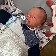 Mayron participe au concours pour gagner de l'argent avec cette photo : newborn, baby, sleeping, pacifier, blanket, toy, infant, cute, face, clothing, bed, comfort, indoors, peaceful, rest, soft, warm, child, person, nap